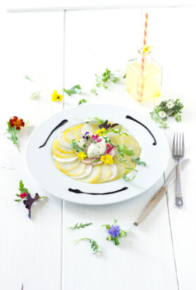 Yellow beetroot carpaccio with fresh goat cheese quenelles